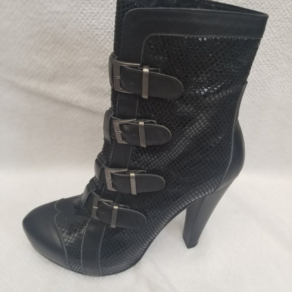 Strapped short leather boots,, new and unworn.